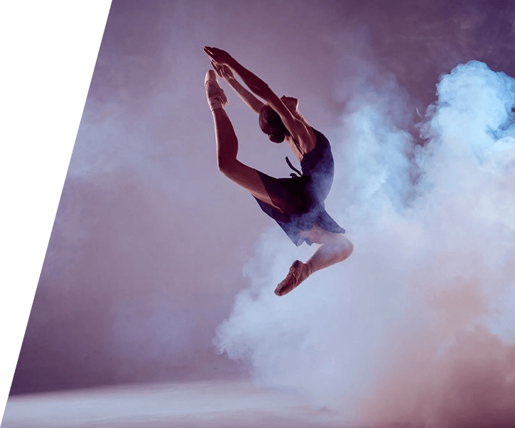 A man jumping in the air with his arms outstretched.