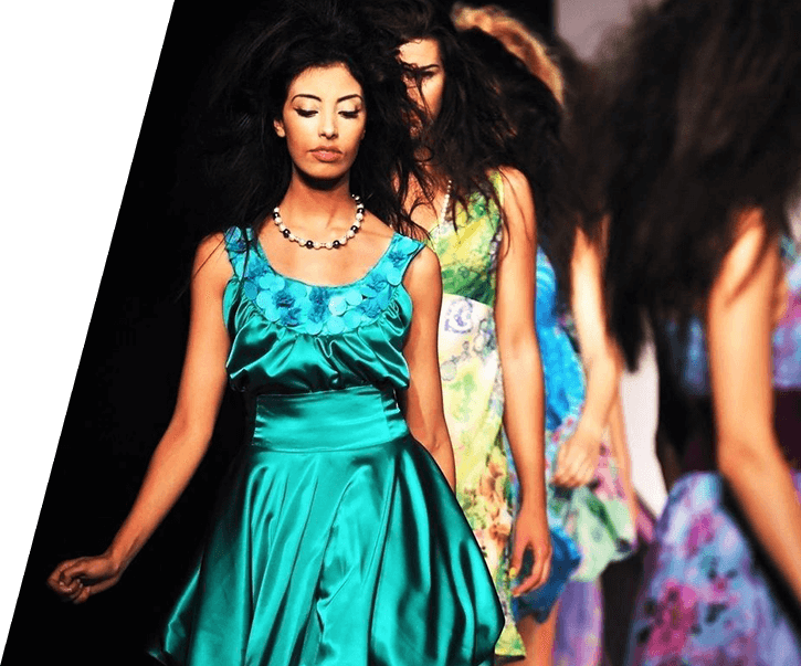 A group of women in dresses on the runway.